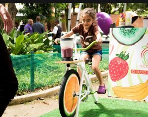 screenshot: GRATUITO! Feira do Bem tem contação de histórias com Emília do Sitio do Picapau Amarelo, oficinas de slime e de cupcake com crianças do Junior Bake off Brasil